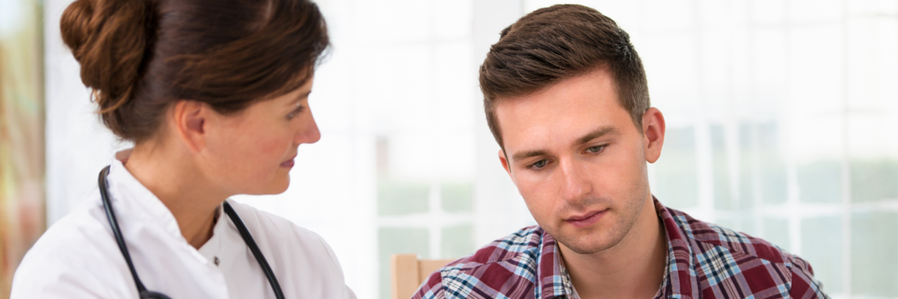 10 Things CHD Patients Need to Know as Adults A doctor talking to a teenage patient.