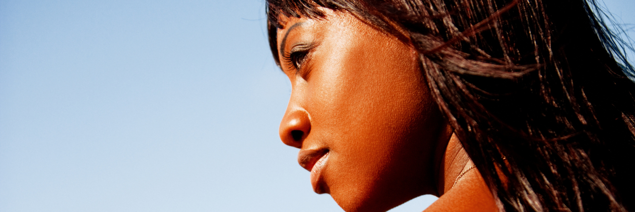 The 10 Changes I've Made Since Becoming Cancer-Free woman outdoor looking over balcony