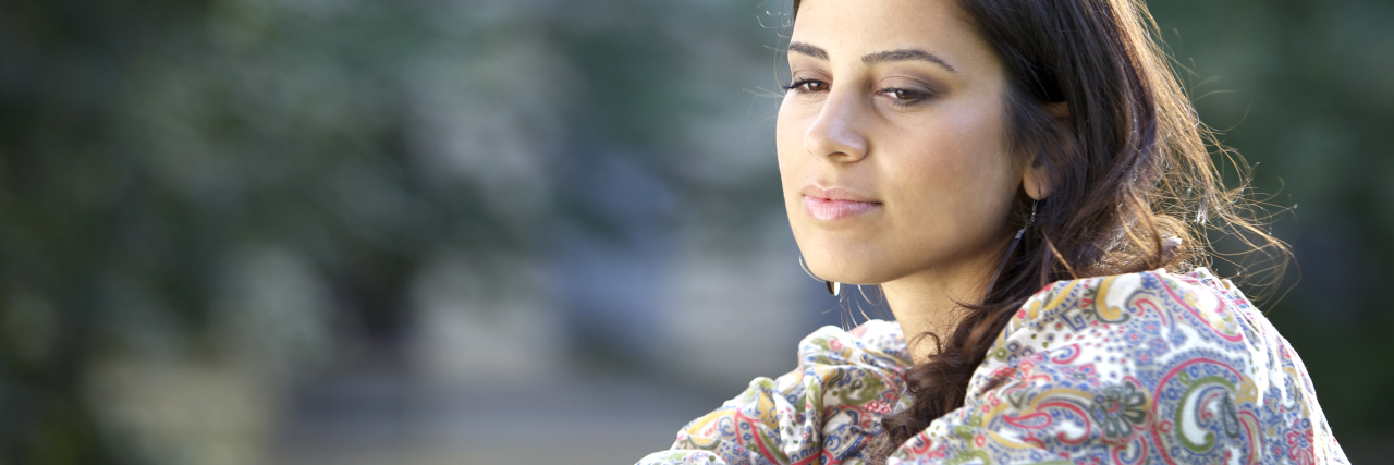 The One Reason I Stopped Punishing Myself With Weight Loss Resolutions A young college student is thinking.