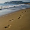 Footprints on the beach.