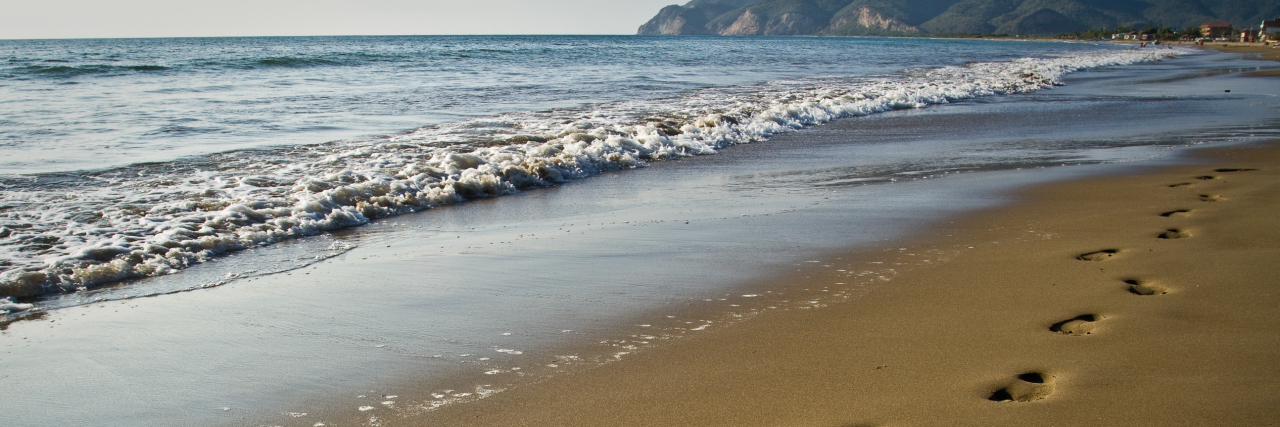 My Secret Life of Having Cerebral Palsy Footprints on the beach.