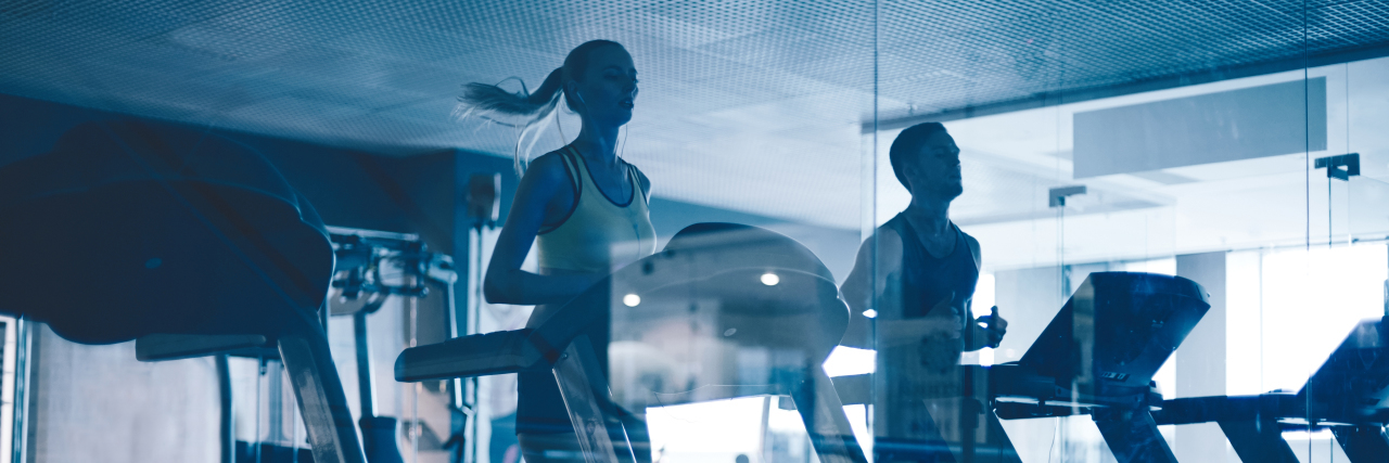 Running Again After Having a Tonic-Clonic Seizure Active young people running on treadmills in sports club