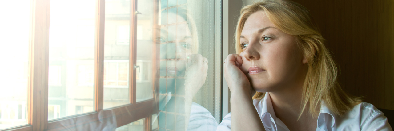 Depression and Rumination: How It Works and How to Beat It Woman looking out window lost in thought rumination