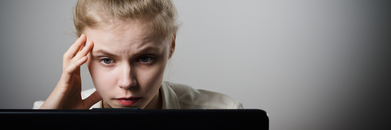 What's It's Like to Be Groomed by an Online Predator Young woman with laptop