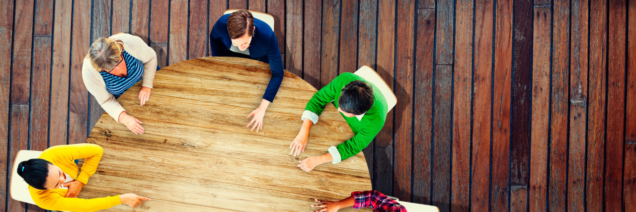 What to Expect in Your First IEP Meeting top view of round table with people at a meeting