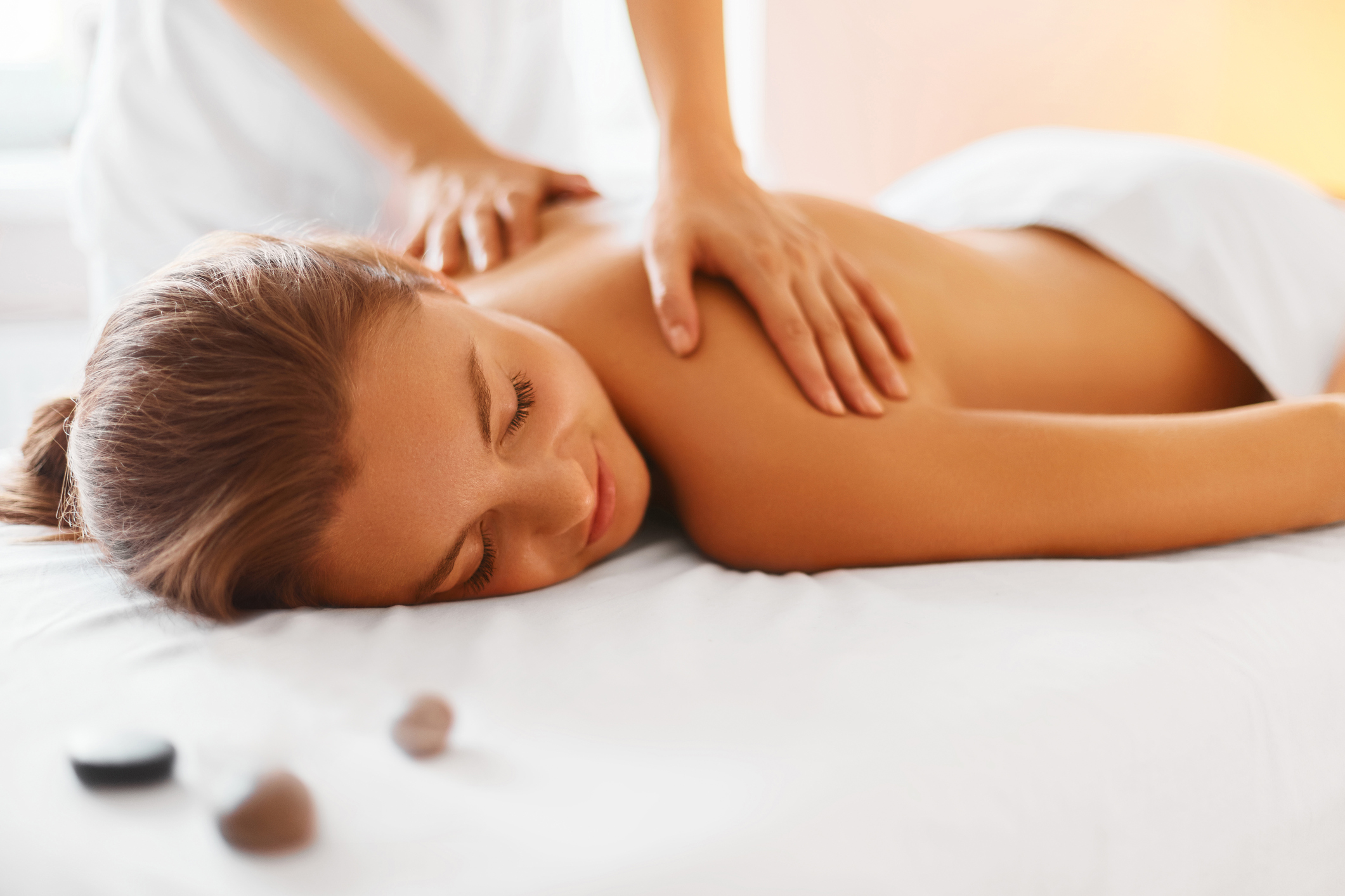 woman getting a massage at a spa