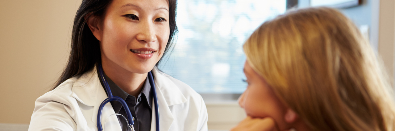 Advice for Doctors Working With Fibromyalgia Patients A doctor helping a patient.