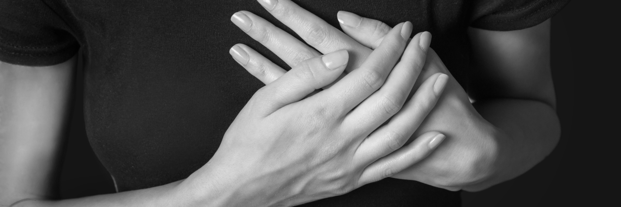 All the Feels: My Take on the Breast Biopsy for Breast Cancer Woman is clutching her chest, heart attack