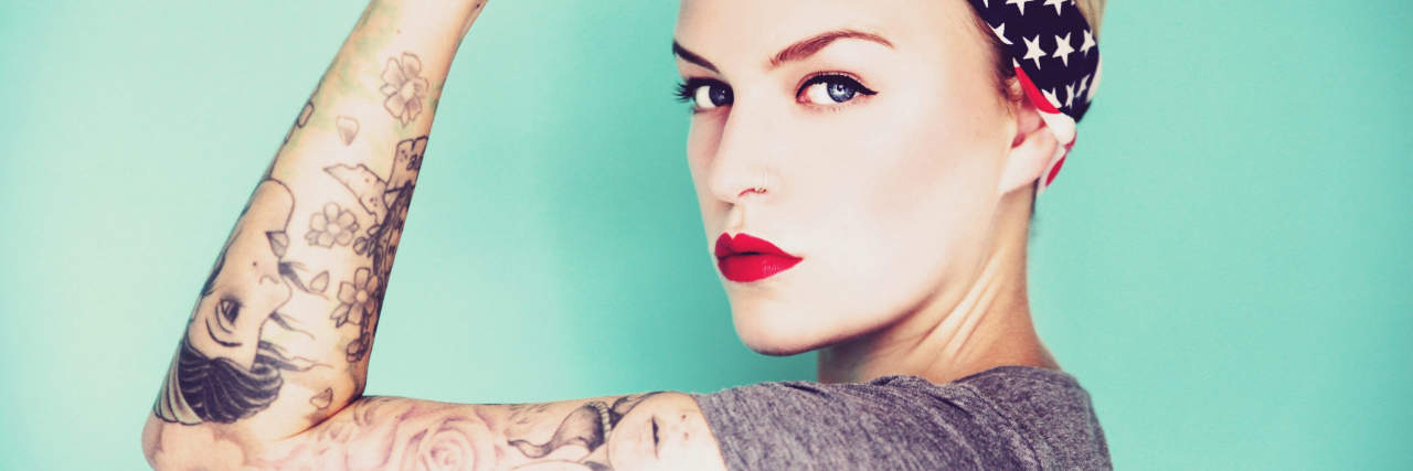 I Am a Strong Woman With Chronic Pain Pin up woman striking a strong woman pose