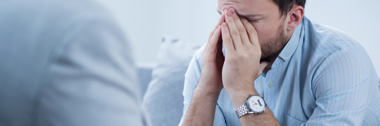 Why Therapy for Mental Health Can Be Hard man crying during therapy session