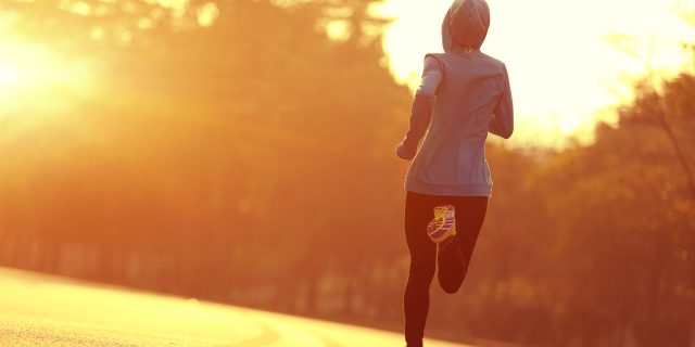 Why I Started Running Despite My Rare Lung Disease young fitness woman runner athlete running at sunrise road