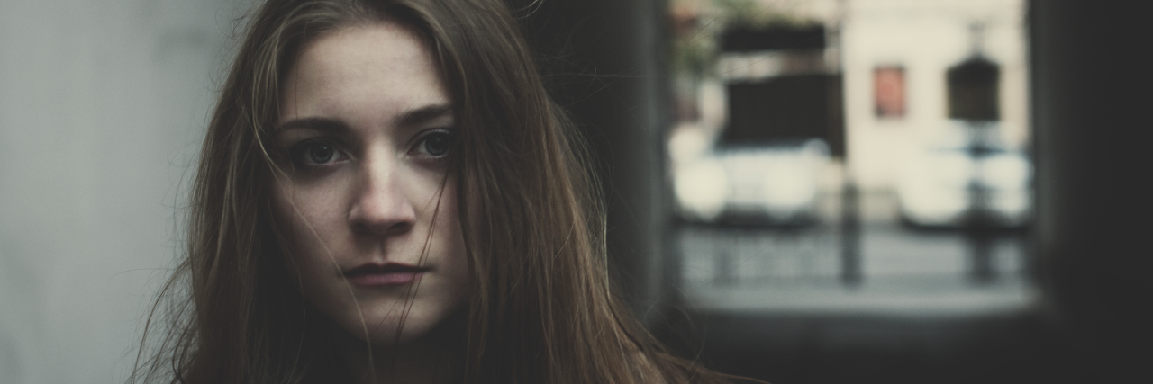 I Never Dreamed My Teenage Daughter Would Want to Die Young pensive long haired sacred girl standing outside alone