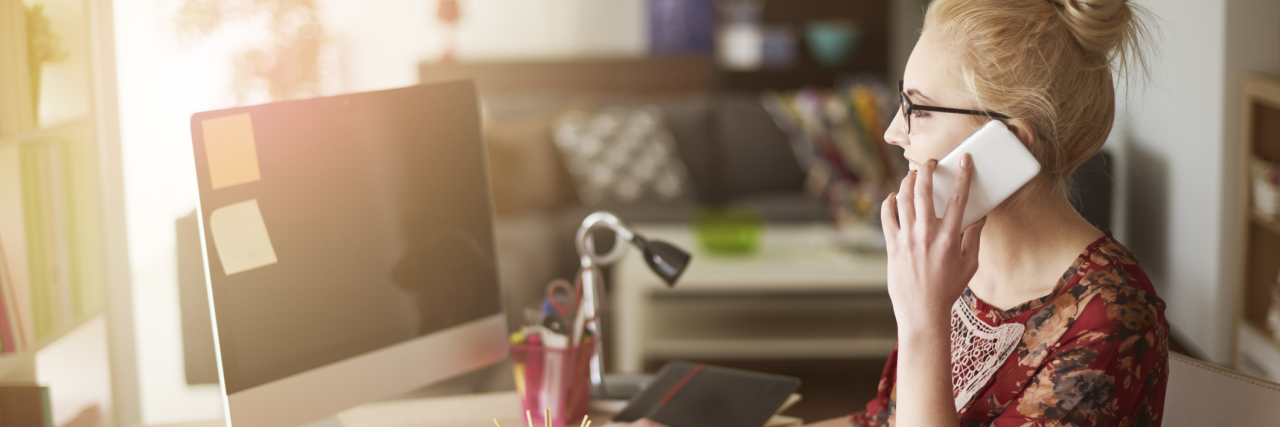 Endometriosis Led to Self-Employment A woman working on her computer at home.