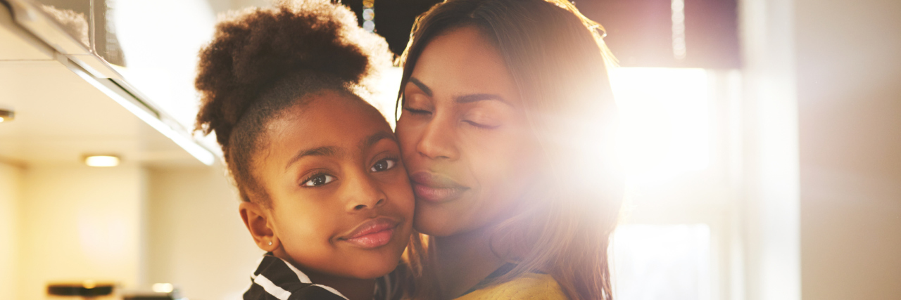 What My Daughter Taught Me When Lupus Made Me Lose My Hair A mother and daughter hugging.