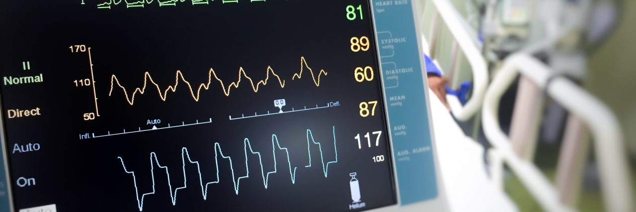 Cerebral Palsy and Baclofen Pump Malfunction Close up EKG monitor in ICU room.