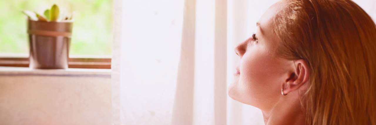 My New Year's Goals and Resolutions as Someone With Chronic Illness woman relaxing in a bath with candles