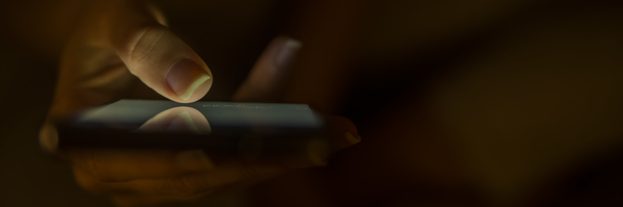 The One Text That Gave Me Hope on a Bad Mental Health Day Close up of female hands using modern smartphone at home at night