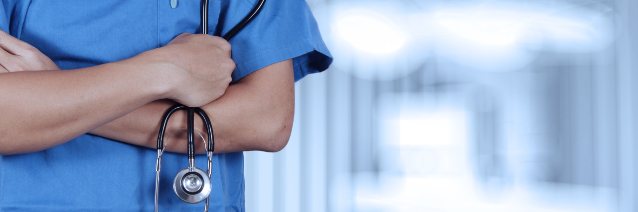 Nurse holding stethoscope.