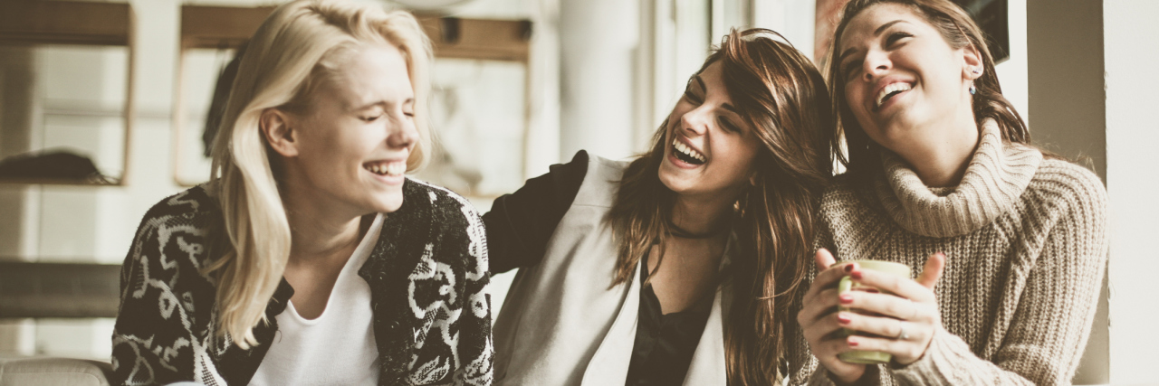 Reasons I'm Actually Grateful for My Bipolar Disorder group of female friends at home laughing together having fun