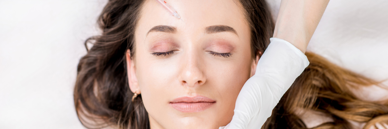 woman receiving botox treatment for migraine