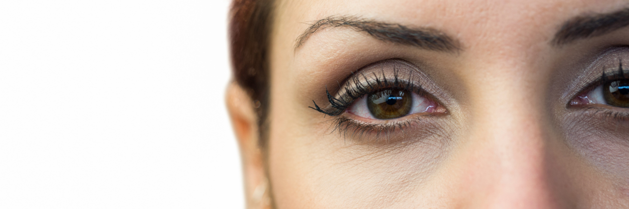 The Moment I Finally Acknowledged My Disordered Eating Close-up portrait of woman face against white background