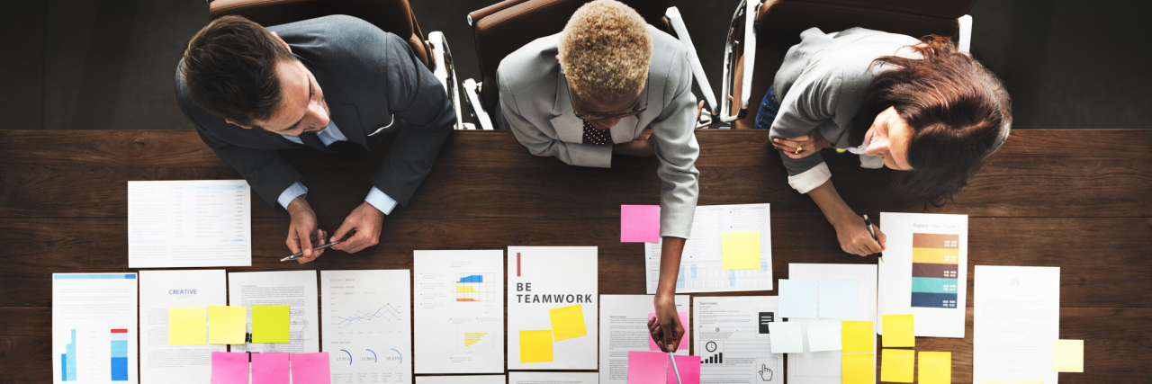 How I'm Finding Fulfillment After My Illness Made Me Leave My Career People working at a conference table.