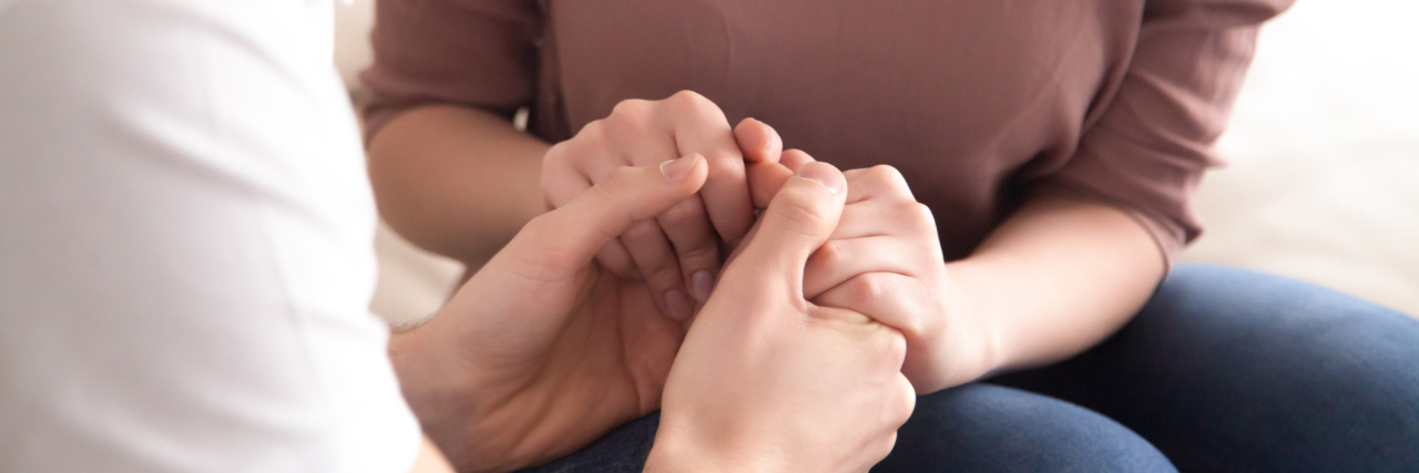 How to Help Someone Deal With Dissociative Identity Disorder Triggers man and woman holding hands comforting support