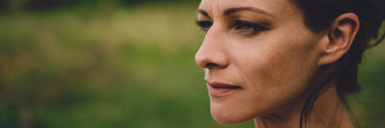 The One Thing That Made Me Realize I Was Recovering From Depression Portrait of woman with brown hair and green eyes