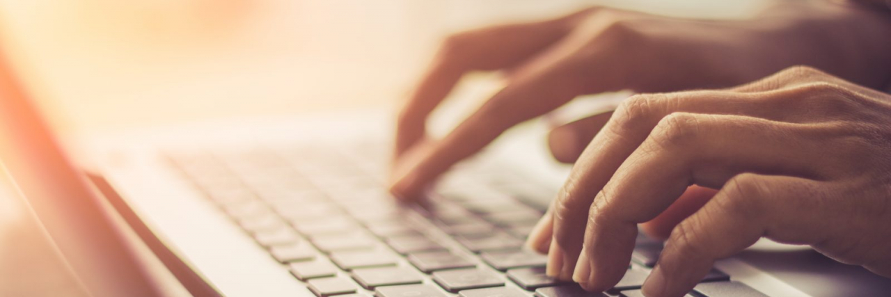 Reddit Just Helped Save the Life of a Woman Having a Seizure Close up of person's hands typing on a keyboard of a computer