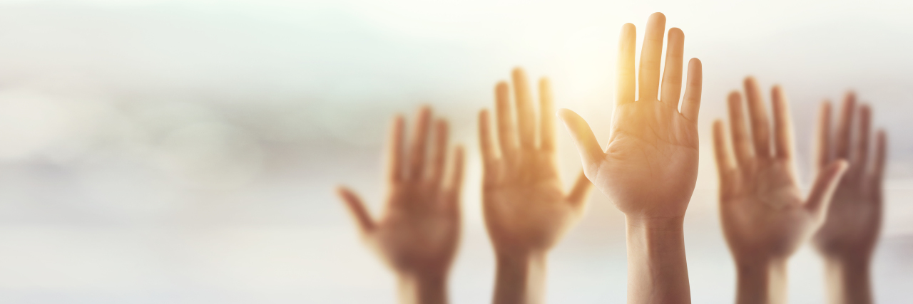How to Adjust to Being Disabled With Pompe Disease Silhouette, Raising Hands for Participation, many people's hands up.