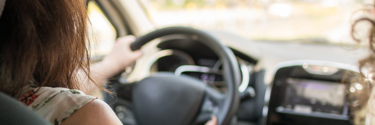 Why I Traveled for Post Treatment Cervical Cancer Care Cropped rear view shot of a young woman driving a car