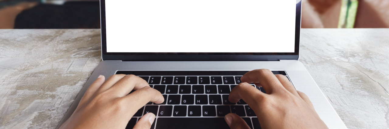 Facebook's Feature 'On This Day' Can Help Track Mental Health close-up hand typing keyboard computer in coffee shop