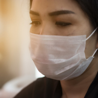 woman wearing mask to protect from being sick