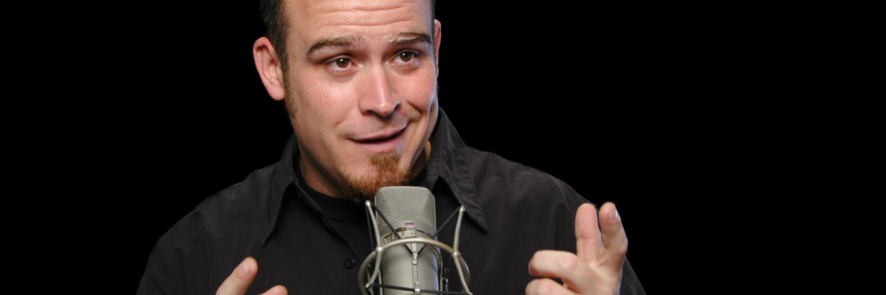 Open Letter to Comedians Who Insult People With Disabilities Comedian performing in a club.