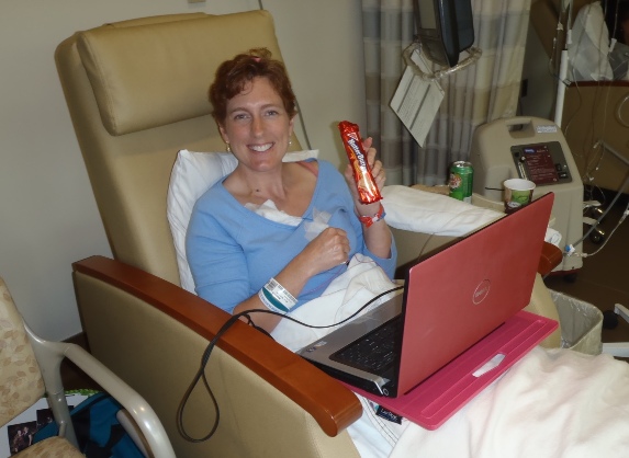 Heather McCollum with laptop in hospital