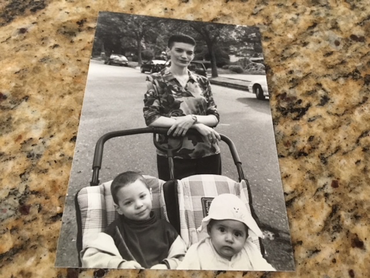 A photo of the writer and her two kids in the stroller.