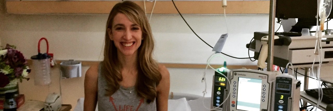 When a Child Noticed My TPN Backpack A photo of the writer smiling in a hospital bed.