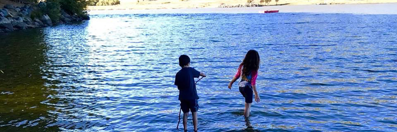 Oyuki's children playing in a lake.
