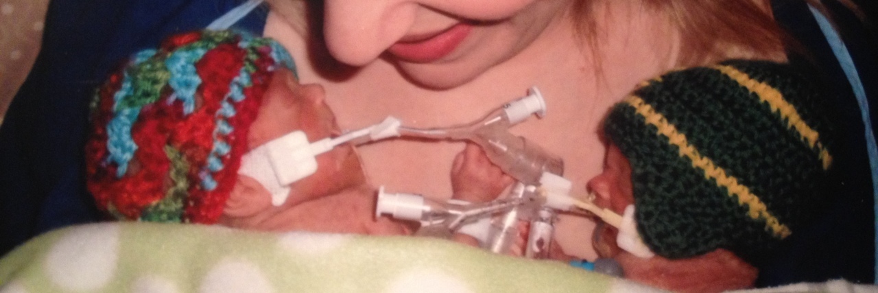 Dear NICU Nurses, Thank You for Being Our 'Miracle Workers' Mother leaning close to baby in NICU