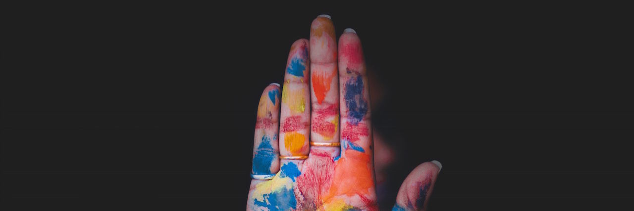 a hand covered in paint