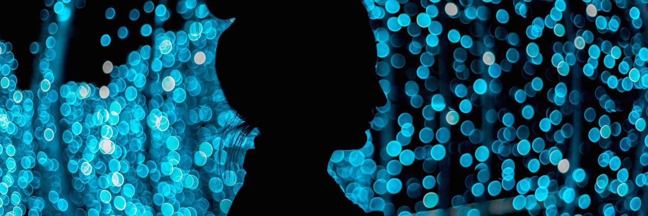 What It's Really Like to Live With Borderline Personality Disorder woman in front of lighted background