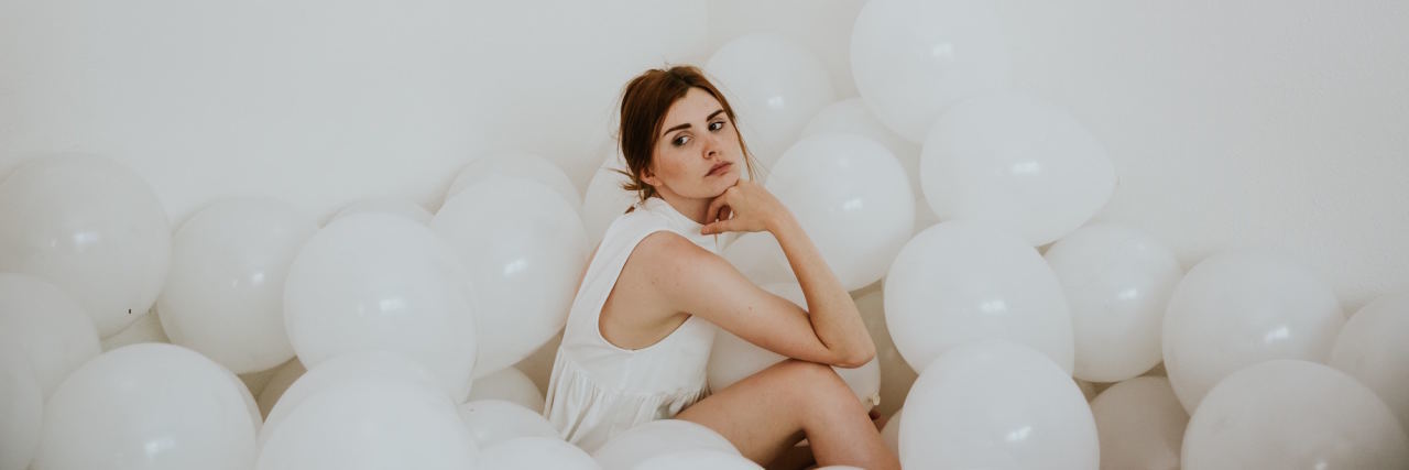 woman surrounded by balloons