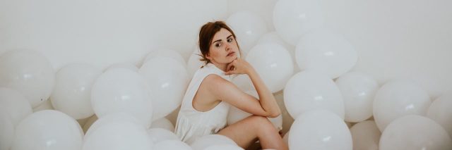 woman surrounded by balloons