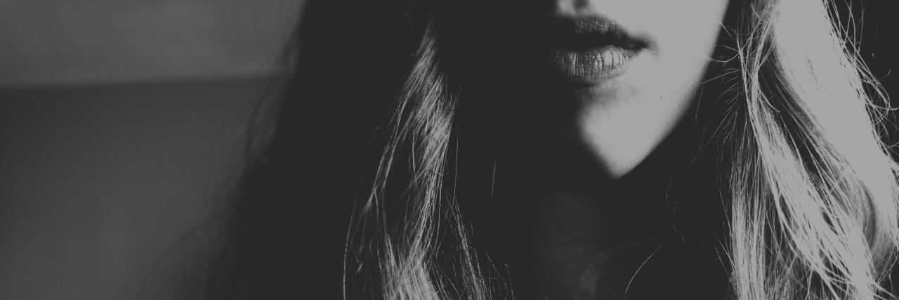 Fear of Abandonment and Borderline Personality Disorder black and white faded portrait of young woman with long hair