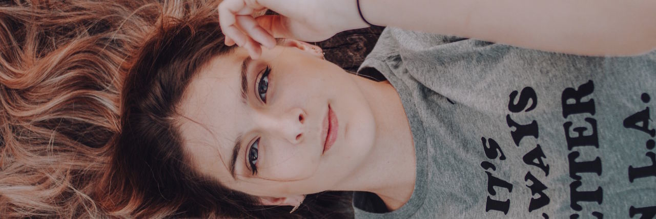 What Having a Crush on Someone Is Like When You Live With Anxiety woman looking at camera