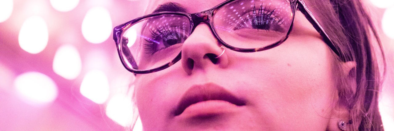 People Don't Know I Have 'High-Functioning' Anxiety woman in pink lighting