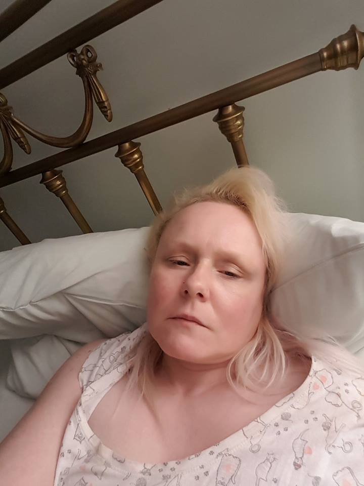 woman lying in bed awake