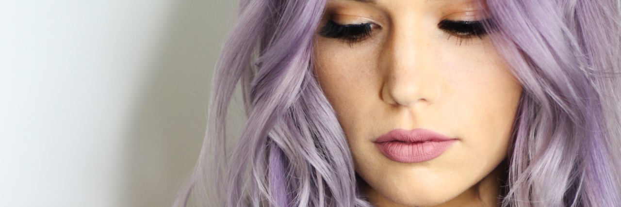 Why I'm Not Just 'Nervous' as Someone With an Anxiety Disorder woman purple hair