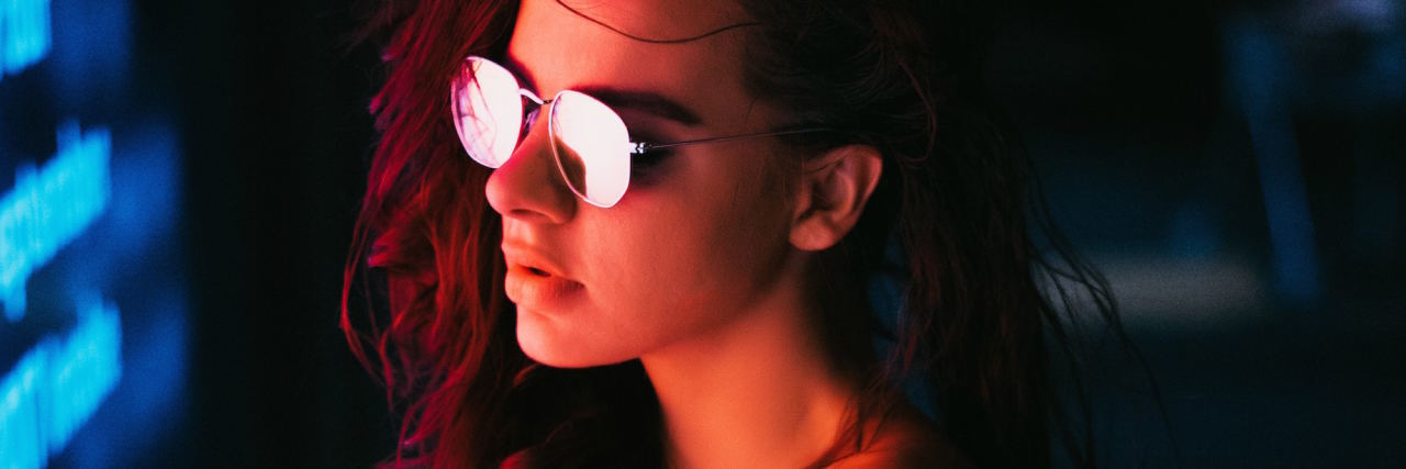 Why I Read and Watch Sad Things When I'm Depressed woman glasses