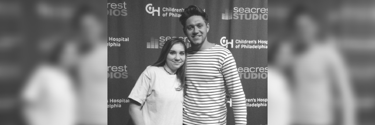 girl in a hospital gown posing with niall horan